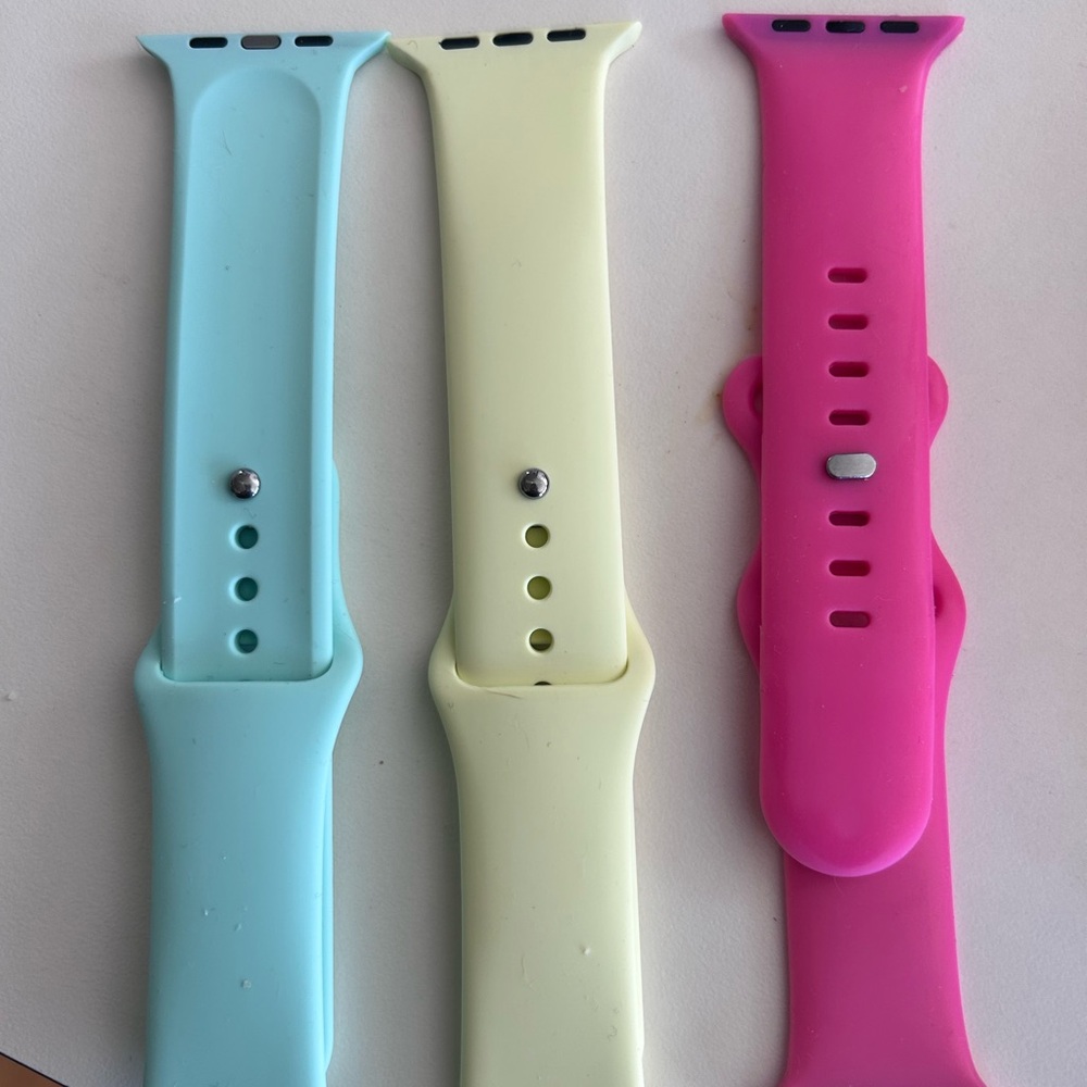 Pink Apple Wearable Bands Blue, Yellow are unknown Brands. 42/44/45 mm watch.